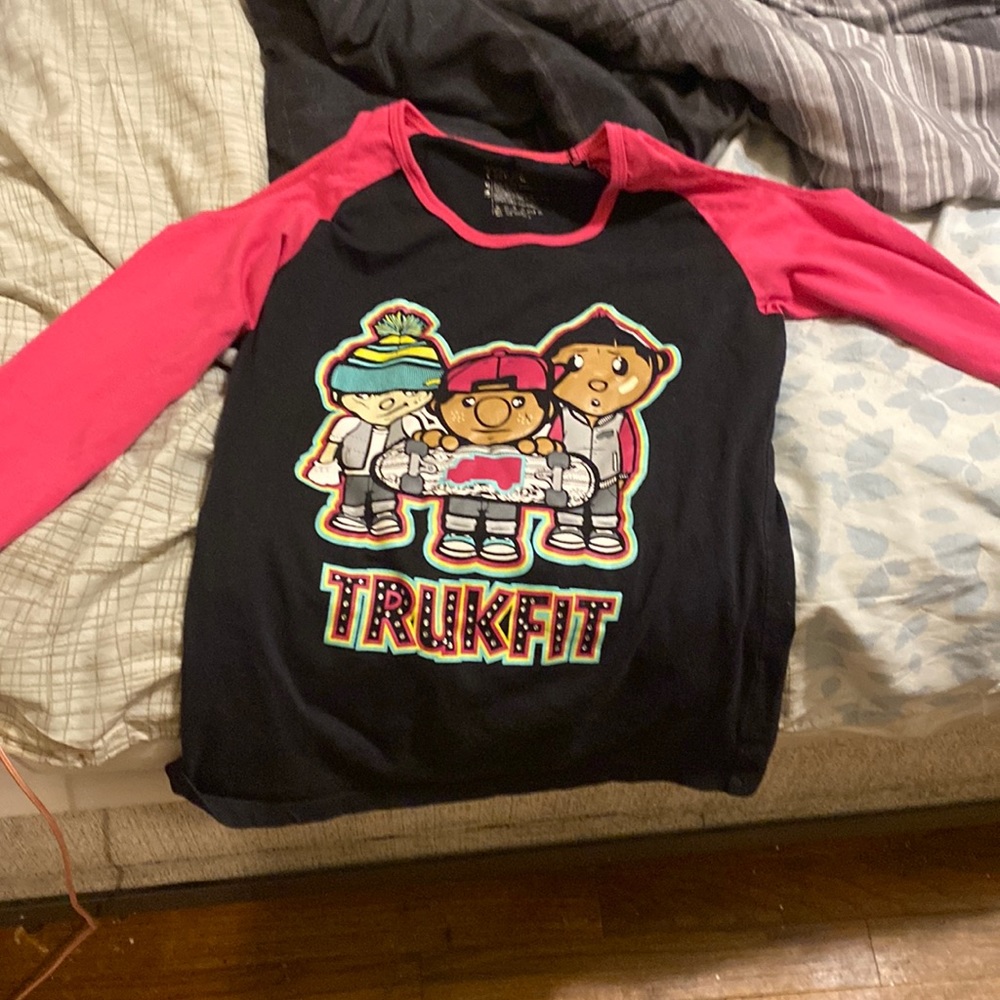 It’s pink a long sleeve .